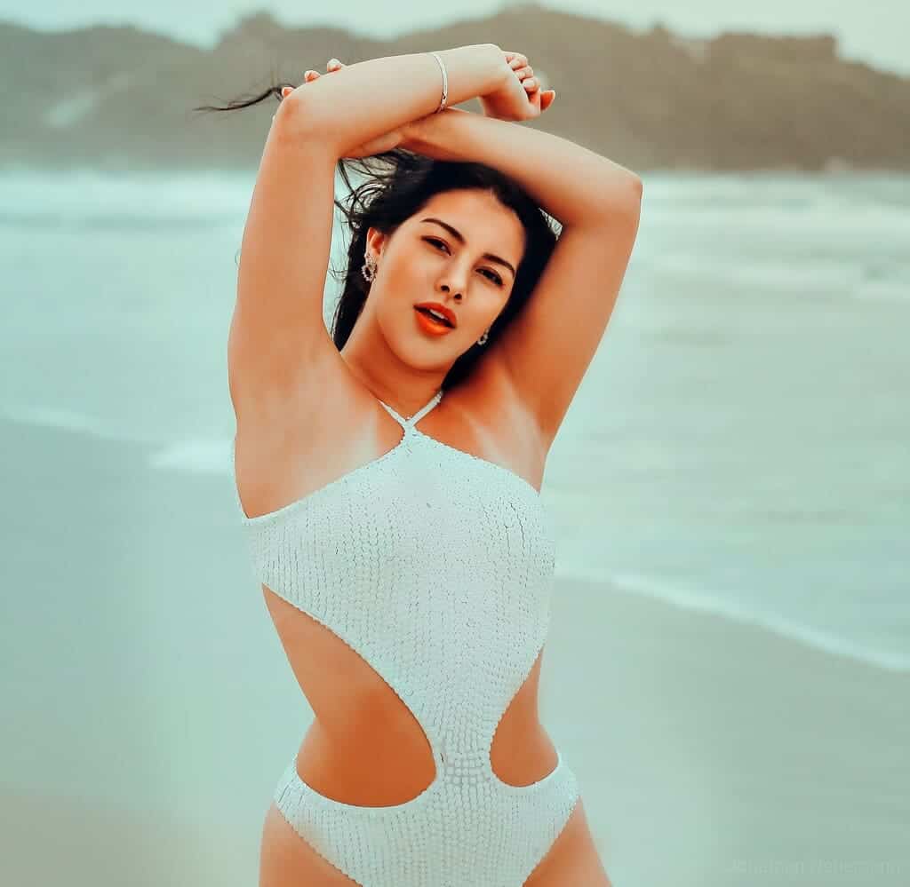 Sexy Woman in White Monokini Posing at the Beach