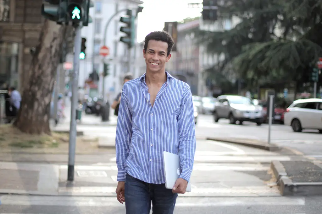 positive-young-male in Vertically Oriented Patterns shirt-crossing-road